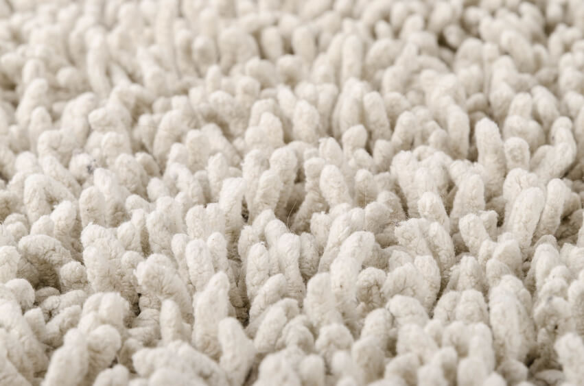 Close up of a white fluffy new and clean carpet.